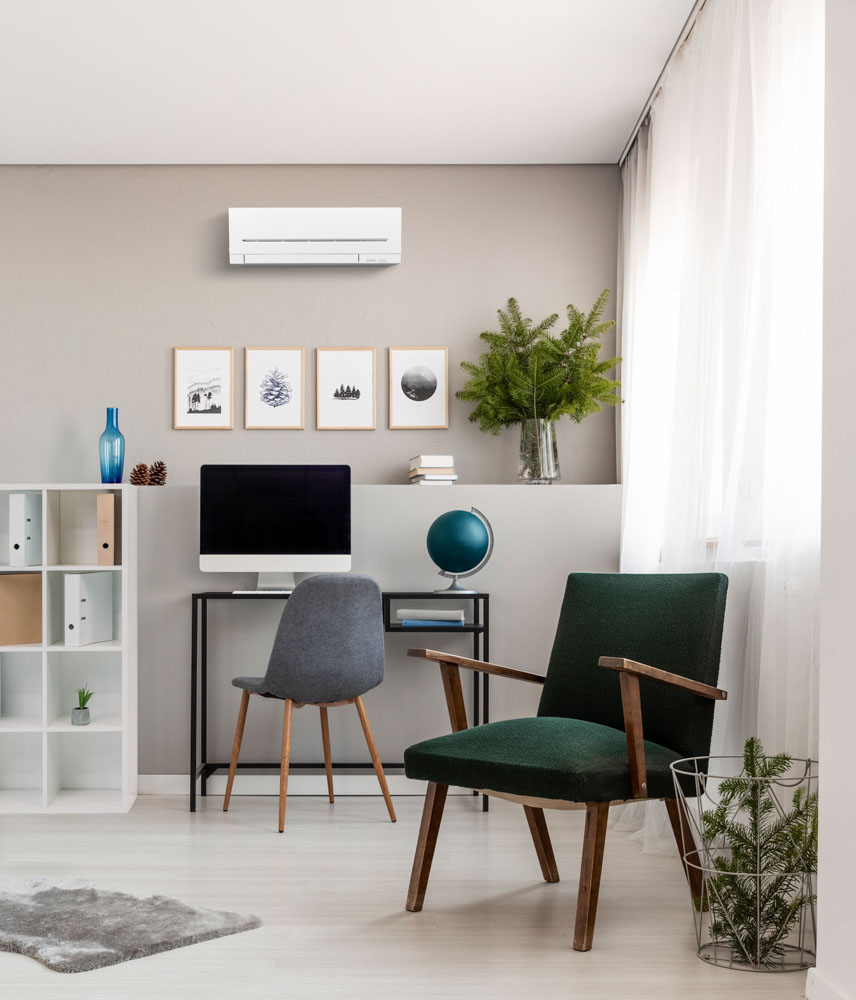 Grey pouf on natural linen carpet in fashionable teenager's room with retro armchair and industrial desk with computer